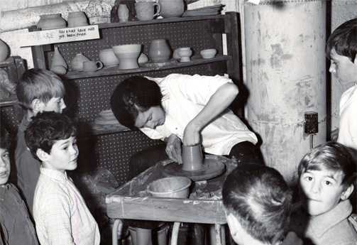 Throwing demonstration for children in the Kingston Ceramists' Guild's first studio space at the Richardson Bath House, circa 1970.